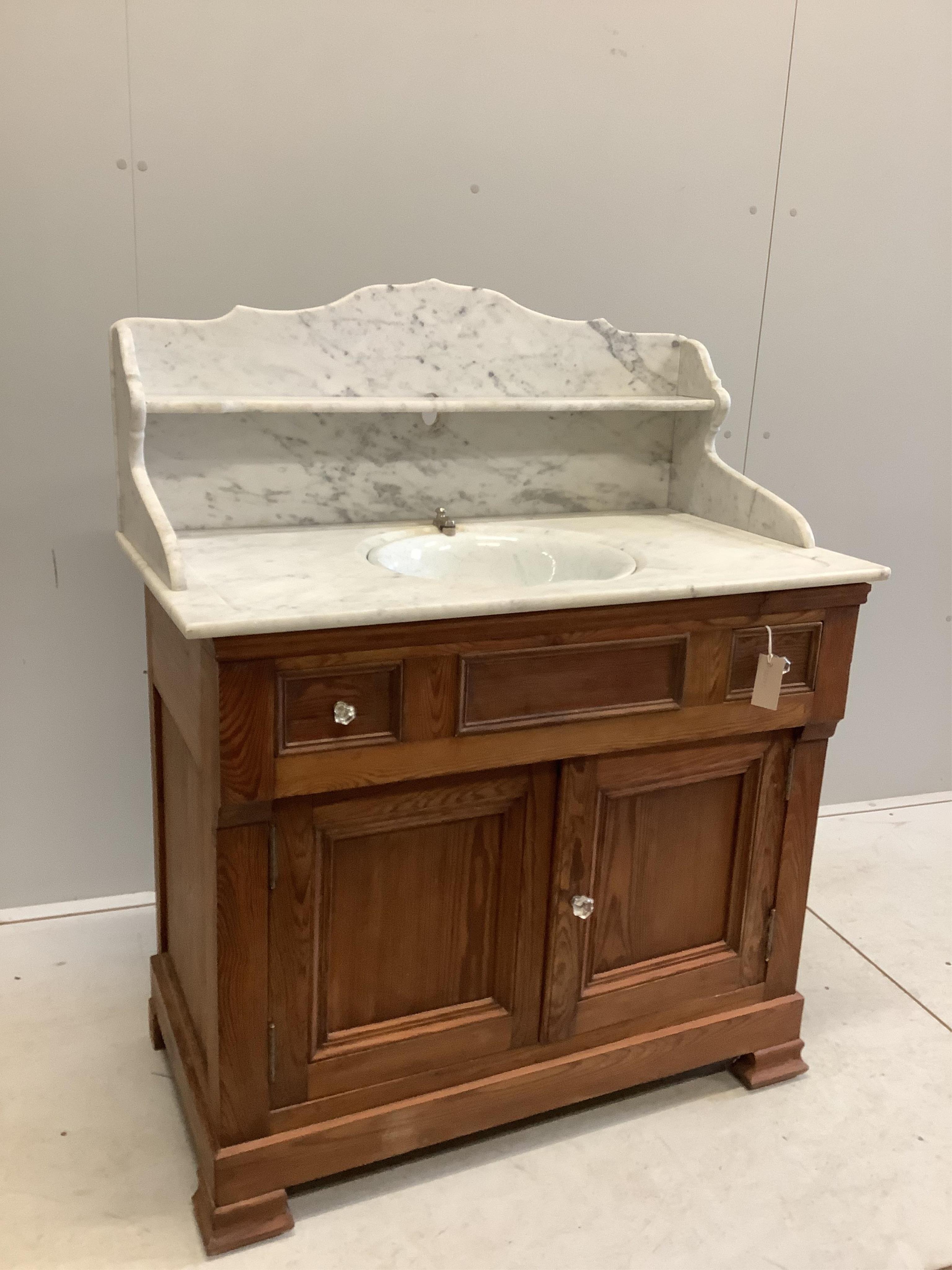 A late 19th century French pine marble top washstand with Boldings Patent swivel sink marked E.P. Concessionaire, Paris, width 92cm, depth 52cm, height 102cm. Condition - fair